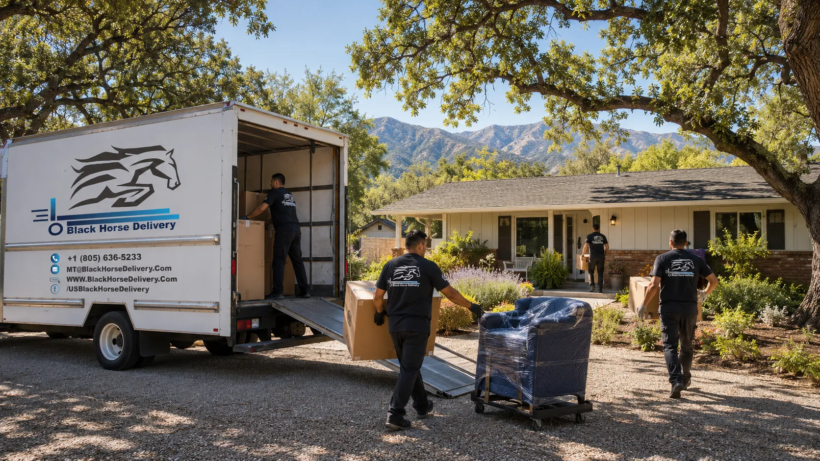 Boxes being unloaded at an Ojai ranch-style home among oak trees