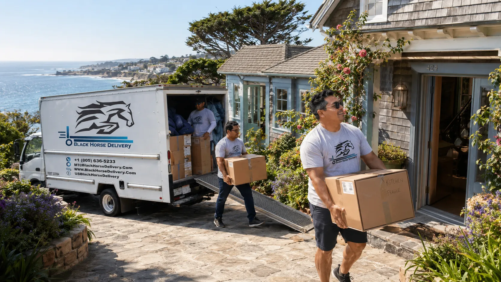 Movers unloading a truck at a Summerland hillside cottage overlooking the ocean