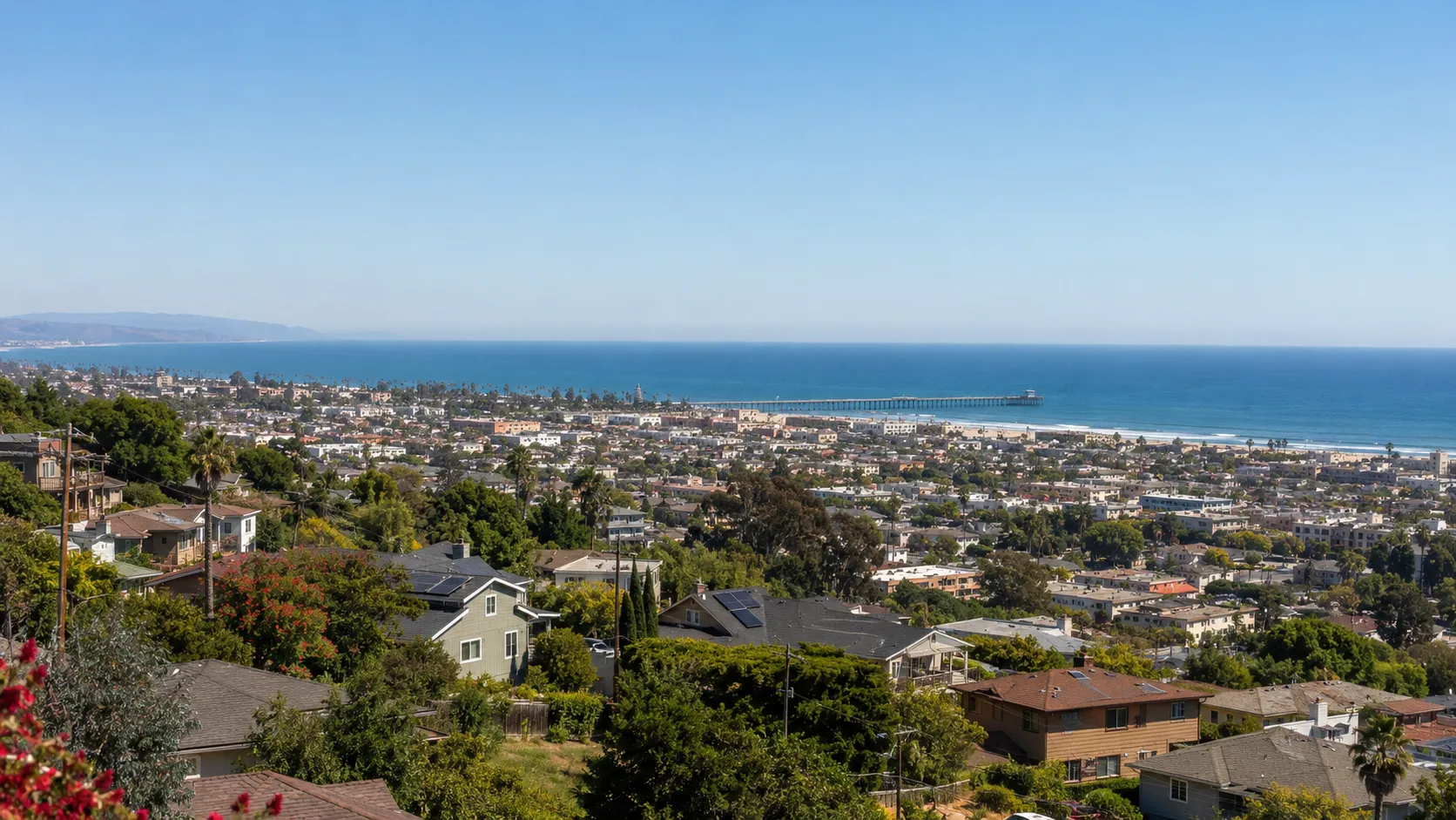 A family relocating to a Ventura home with the pier and ocean in the distance